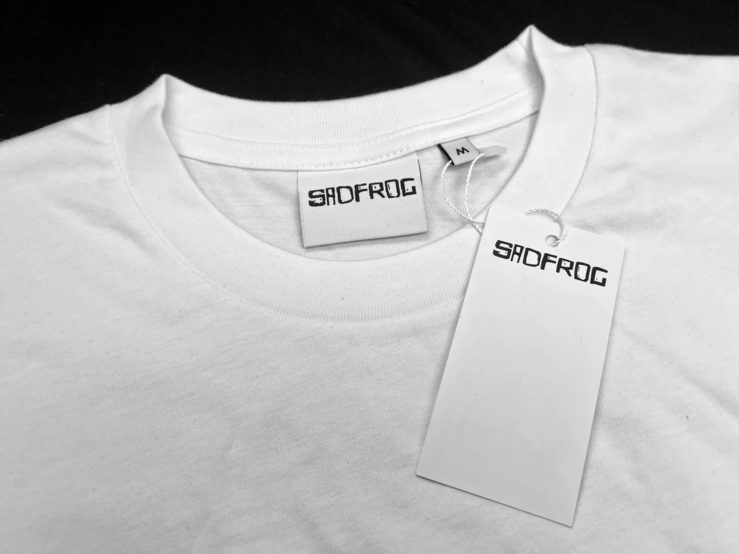 swing tag attached to tshirt